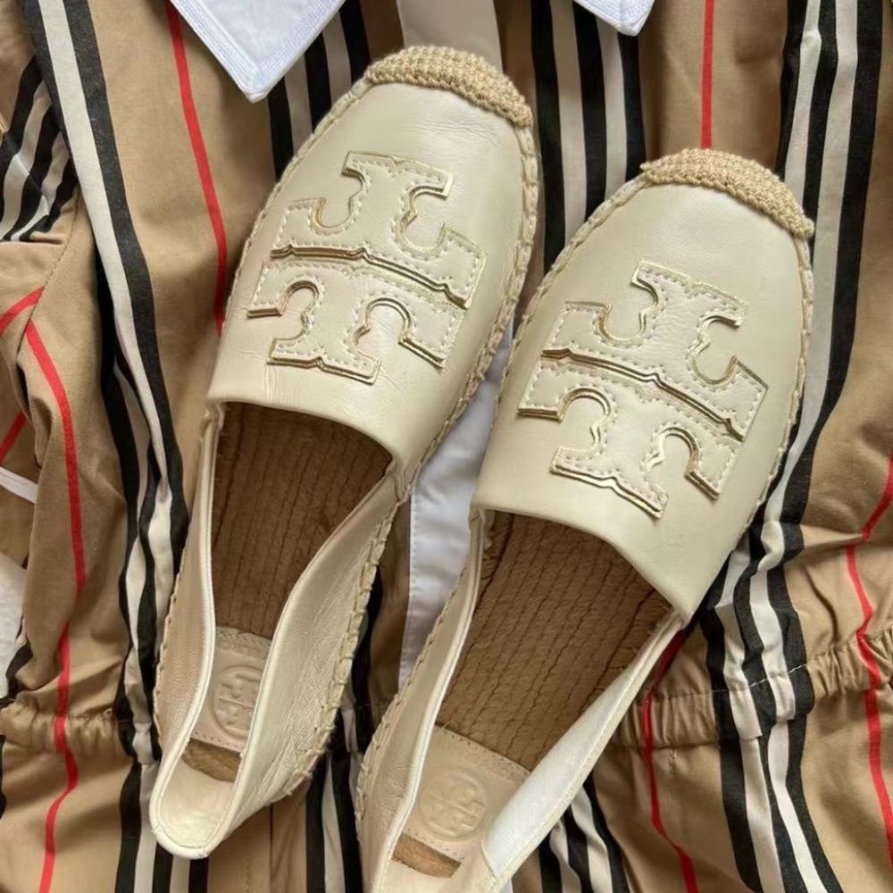Tory Burch's best looking shoes are a milky white women's 7